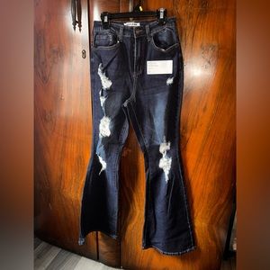 Dark wash. High rise flare. Size 5.